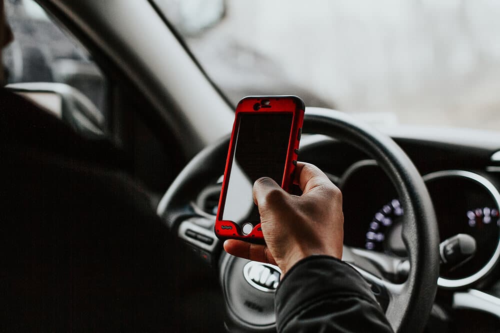 Person using cell phone while driving
