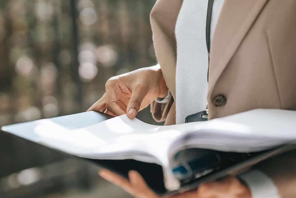 Person holding binder